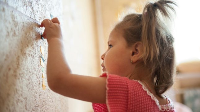 3 year old behaviour decorating a wall