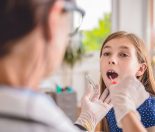 How is a sore throat caused