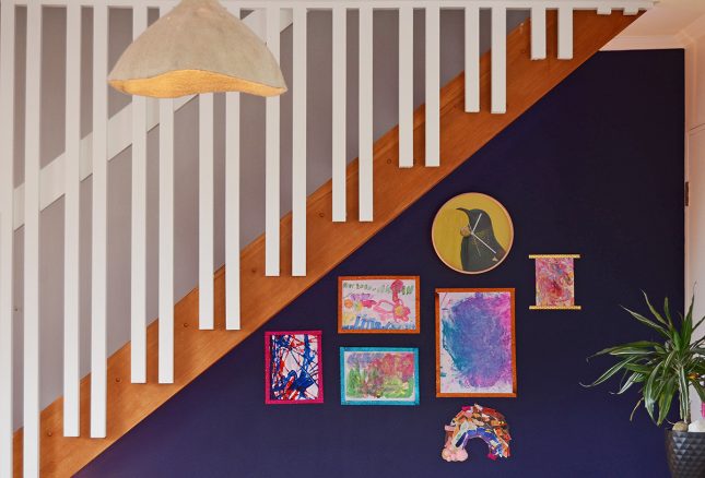 Under stairs kids study nook Magnetic art display wall